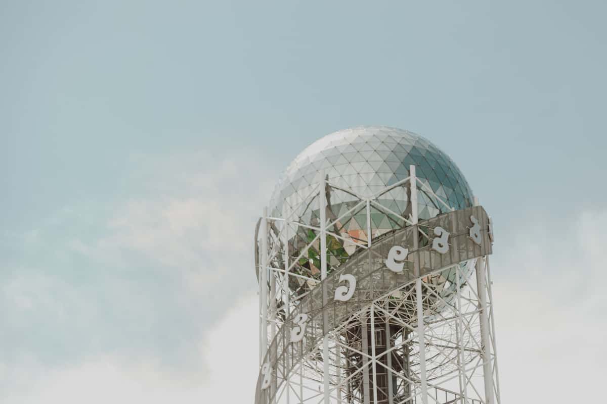 The crown of Batumi's Alphabet Tower, Georgian letters spiralling its helix against the sky.